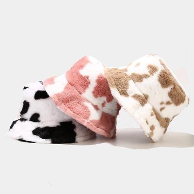 China Keep warm Wholesale Winter black white Cow Print Fisherman Hats Faux Fur Furry Plush Fluffy Warm Bucket Hat for sale