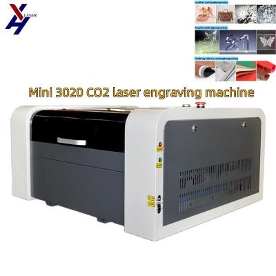 China M2 Ruida Awc Topwisdom System 4040/3050/3020/4060 CO2 grabador y cortador con láser para papel MDF en venta
