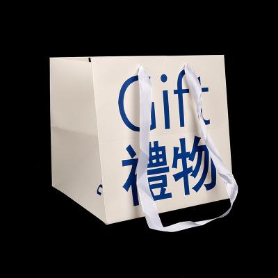 China Wholesale Recyclable Customize Packaging Printing Cardboard Art Paper Gift Shipping Bag With Handle for sale