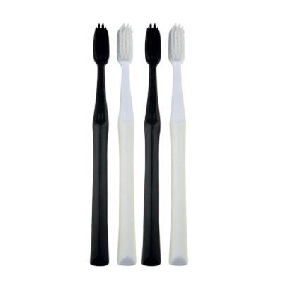 China Disposable Black And White Color Handle Charcoal Bristle Toothbrush for sale