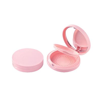 China Matte Pink Compact Powder Case zylinderförmiger kundenspezifischer Logo Empty Powder Compact zu verkaufen