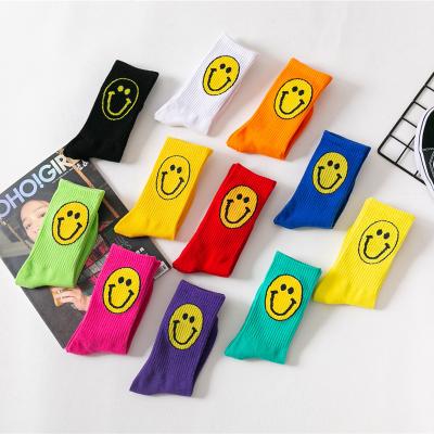 China 2021 Wholesale Cute Korean Cotton Winter Designer Athletic Warm Thermal Sports Smile Happy Face Socks For Woman for sale