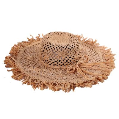 China 2020 New Character Design Handmade Natural Floppy Straw Hat Summer Cool Hollow Beach Straw Hat For Woman for sale