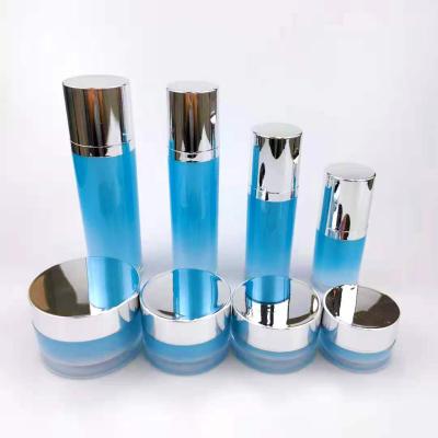 China Cosmetic Round Cylinder Gradient Packaging Container Serum Lotion Cream Jars Blue Acrylic Plastic Cosmetic Sets for sale