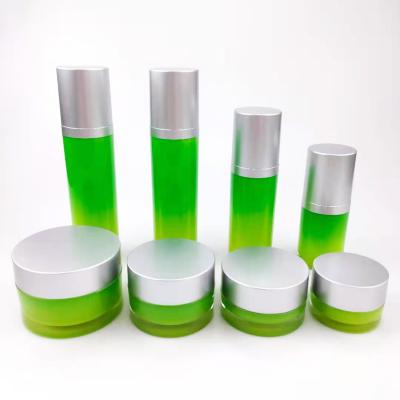 China Cosmetic gradient green luxury cylinder round acrylic airless sets of 10g15g30g50g cream jars and lotion pump bottles for sale