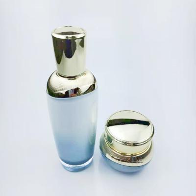 China Unique design luxury cosmetic luxury gradient blue acrylic cosmetic bottles 100/120ml and 30/50g jars sets in stock for sale