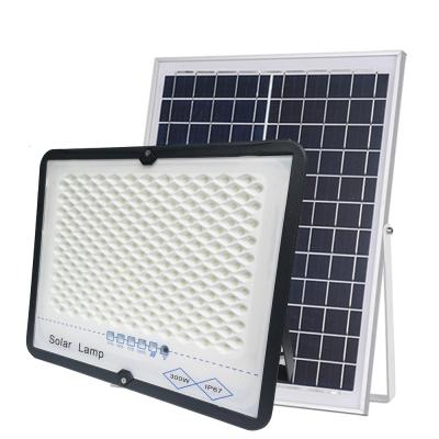 China New Design Warehouse Flood 100w Solar Ground Motion Sensor Led Solar Garden Light for sale