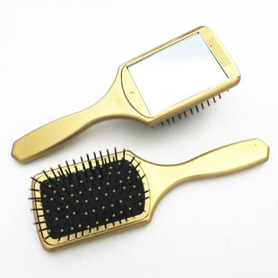 China Cushion Gold Paddle Plastic Hairbrush With Removable Mirror On The Back for sale