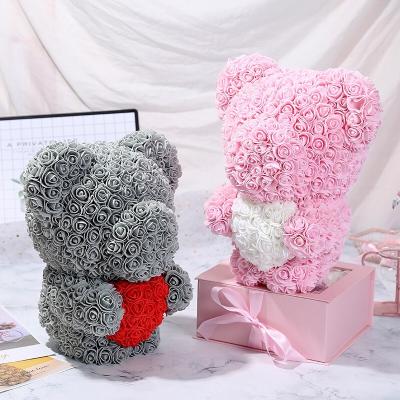 China Natural Touch Customized 60cm Cute Standing Artificial Flower PE Foam Flower Bear Holding Teddy Rose Bear for sale