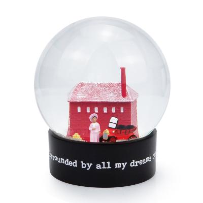 China Luxury Red Pink Lady Water Snowball Europe Building House Souvenirs Customize Lovers Snow Globes Black Base Custom Snow Globe for sale