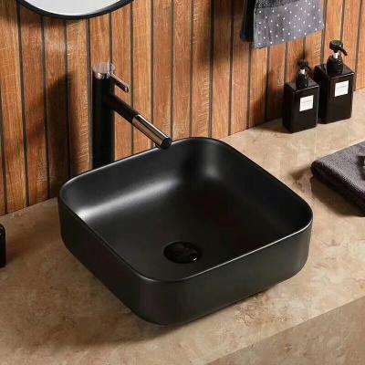 China Modern Fancy Small Ceramic Sink Matte Black Color Bathroom Vessel sinks for sale