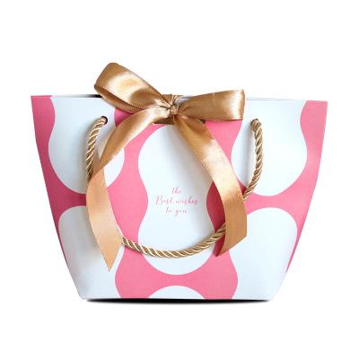 China Luxury Clothing Shopping Handmade Custom Printing Retail Gift Packing Art Paper Bag With Logo Ribbon Handle For Clothing for sale