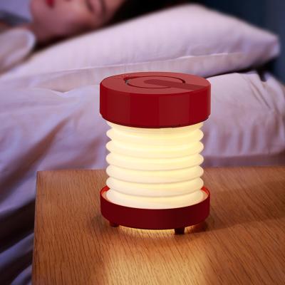 China Modern New Product Night Light Bedroom Care Bedside Lamp Folding Speaker Atmosphere Wireless Colorful Camp Fill Light for sale