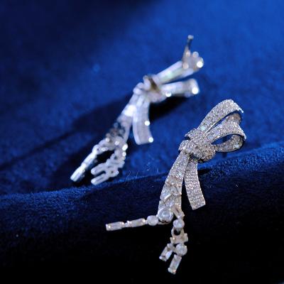 China Wholesale CLASSIC Jewelry 18k Solid Gold Diamond Bow Ties Wands Wholesale China Factory English Lock Circle Earrings For Women for sale