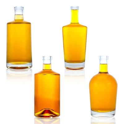 China Avialable Clear Oval Shape Flask Wine Bottle 500ml 700ml 750ml With Corks for Beverage for sale