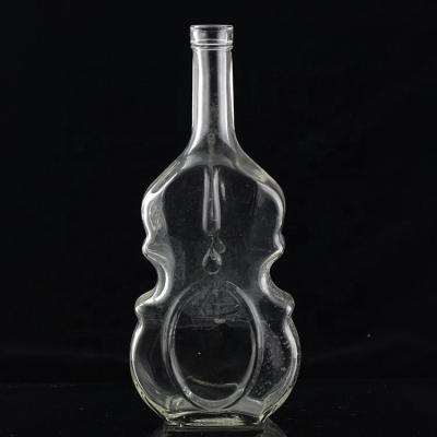 China 700ml Guitar Shaped Glass Bottles With Cork Cap for Clear or Customized Vodka Whisky for sale