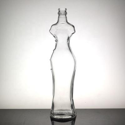 China Sexy Female Body Shaped Bottle Unique Glass Liquor Bottle With Crown Cap for sale