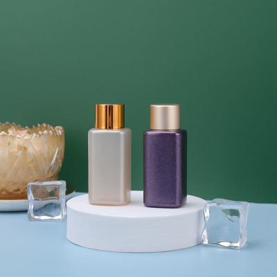 Cina bottiglia cosmetica di plastica dell'ANIMALE DOMESTICO del campione 20ml della bottiglia porpora di lusso di imballaggio di plastica in vendita