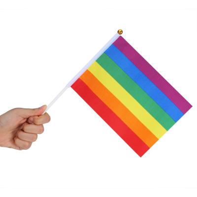 China Cheap Waving Rainbow PENNANT Gay Flag LGBT Pride Event Or Festival Hand Flag Stick Flag With Plastic Flag Pole for sale