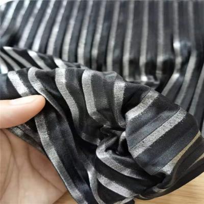 China Embossed Waterproof Lightweight Polyester Foil Pleated Stripe Fabric For Women Girls Skirts And Dress for sale