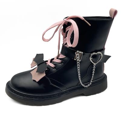 China New promotion fashion trend waterproof pink lace up decoration women winter boots lace up low heel boots women for sale