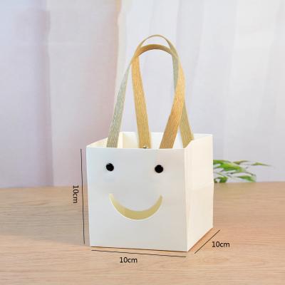 China Recyclable Custom-made Beer Bags Luxury Printed With Ribbon Handle Washable Kraft Paper Shopping Bag Christmas Gift for sale