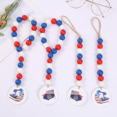 China Wooden Independence Day Bead Garlands with Tassels Patriotic Wooden Bead Ornaments Red White Blue Hanging Prayer Flag Decor for sale