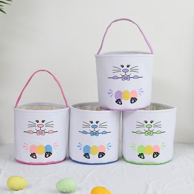 China Portable Wholesale Funny Blue Pink Egg Pattern Green Purple Baskets Receive Buckets Easter Bunny Baskets for sale