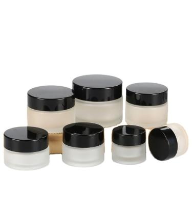 China Freshness Preservation Hot Selling Face Cream Cosmetic Container Frosted Glass Jar With Bamboo Wooden Lid for sale