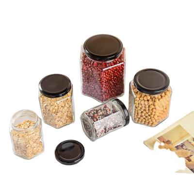 China Freshness Preservation Food Grade Hexagon Shaped Glass Jar Transparent Glass Honey Jar for sale