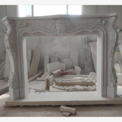 China Durable And Artistic Modern Design Carved Sculpture Indoor Freestanding White Marble Fireplaces for sale