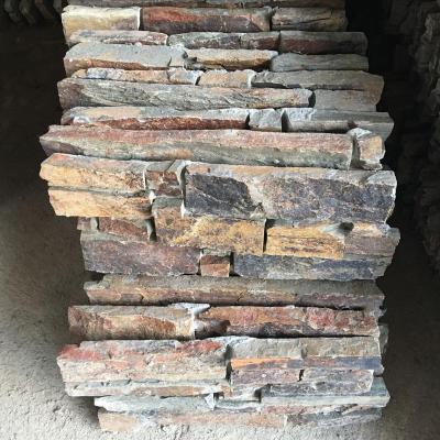 China Modern wholesale exterior decoration rust natural rock slate tiles grow stones facade wall cladding veneer for sale