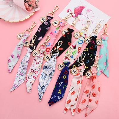 China Other Exquisite Handbag Accessories Ribbon Silk Fabric Key Chain Flower Letter Key Chain Lips Print Bows Key Ring For Women Bag Car for sale