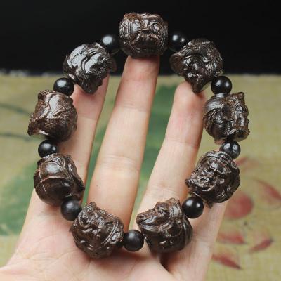 China Guanyin Eighteen Arhats Buddha Head Religious Bead Bracelet for sale