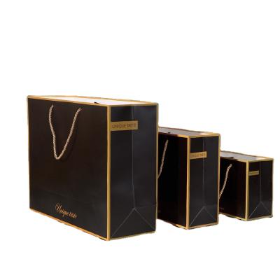 China Custom Recycled Materials Brand Printing Shopping Bags Open Paper Bag Luxury Packaging Logo Gold Foil With Ribbon Handles For Shoes Clothes for sale