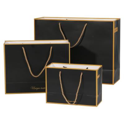 China Custom Recycled Materials Brand Printing Shopping Bags Open Paper Bag Luxury Packaging Logo Gold Foil With Ribbon Handles For Shoes Clothes for sale