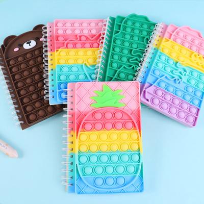 China Wholesale New Design Recyclable Spiral A5 Creative Decompression Finger Bubble Silicone Notebook for sale