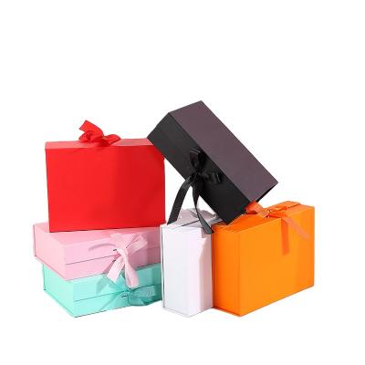 China Luxury Custom Recycled Flat Folding Materials Cardboard Bowknot Foldable Magnetic Gift Box Valentines Day With Ribbon for sale