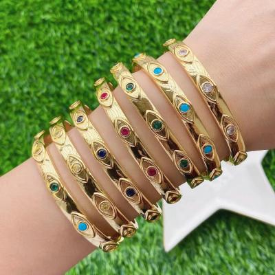 China Fashion Trendy Gold Design Bangle Open Cuff With Rainbow Zircon In Eye Shape Bracelet For Women for sale