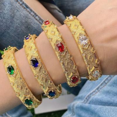 China Fashionable Luxury Rhinestone Inlay Hot Selling Color Rainbow Gold Process Bangle Gold Drawing Brass Bangle For Women Open Size for sale