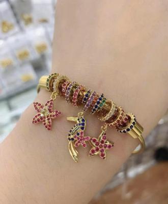 China TRENDY 24k Gold Plated Brass Charm Bracelet Hanging Bangle for sale