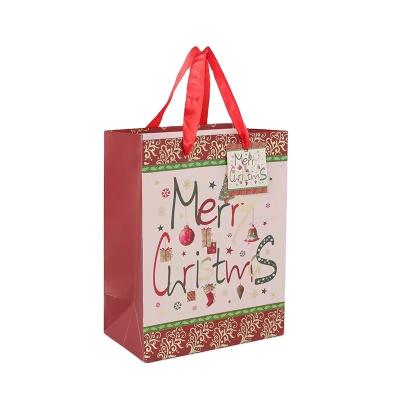 China Food Grade Paper Kraft Christmas Gift Bags 230gsm 250gsm Ribbon Handle for sale