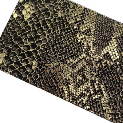 China Waterproof Lady PU Leather Stock PU Coated Synthetic Leather Snake Print Pattern Tan for sale