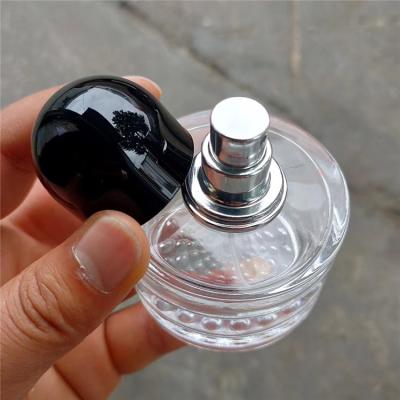 China Personal Care Man Perfume Glass Bottle 50ml Unique Design Round Shape Glass Perfume Bottle Large With Black Ball Cap for sale