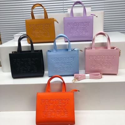 China 2022 New Arrival PVC Solid Color Embossing Lettes Handbag Individuality Candy Color Cross - Body Bag Women Handbag for sale