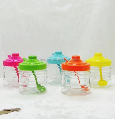 China Sustainable Glass Condiment Spice Jars With Colored Lids And Spoons for sale