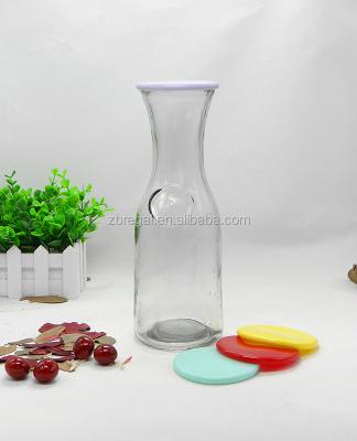 China Sustainable Anchor Hocking glass carafe with colored plastic lid 1 litre. for sale