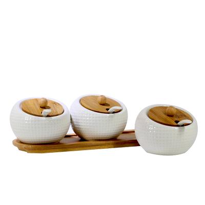 China Easy clean creative bamboo and wood ceramic combination with simple style kitchen condiment storage jar for sale