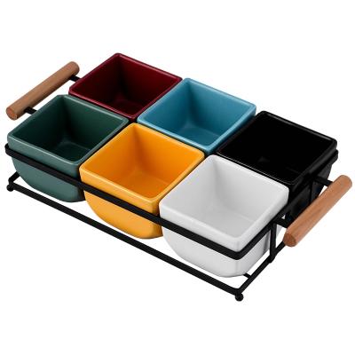 China Creative Modern Style Stocked Colored Glazed Ceramic Snacks Refreshment Dried Fruit Tray With Wooden Handle Bracket Six Lattice for sale