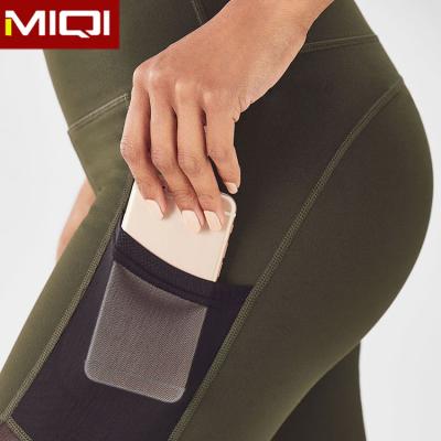 China Breathable Private Label Compression Push Up Running Sports Wear Mesh Recycled Women Gym Clothing Tummy Control Capri Gaiters With Pocket for sale